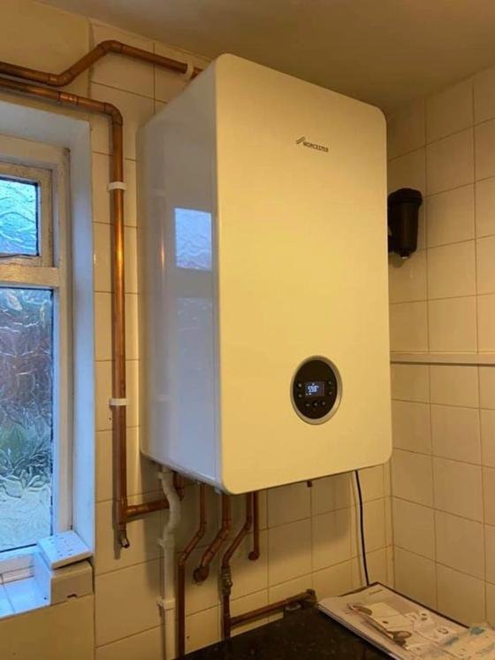 The completed Worcester Bosch boiler running, with the system filter in place