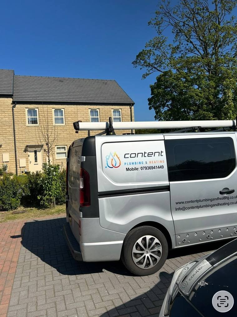 The Content Plumbing and Heating van parked outside a house in Leeds on a job